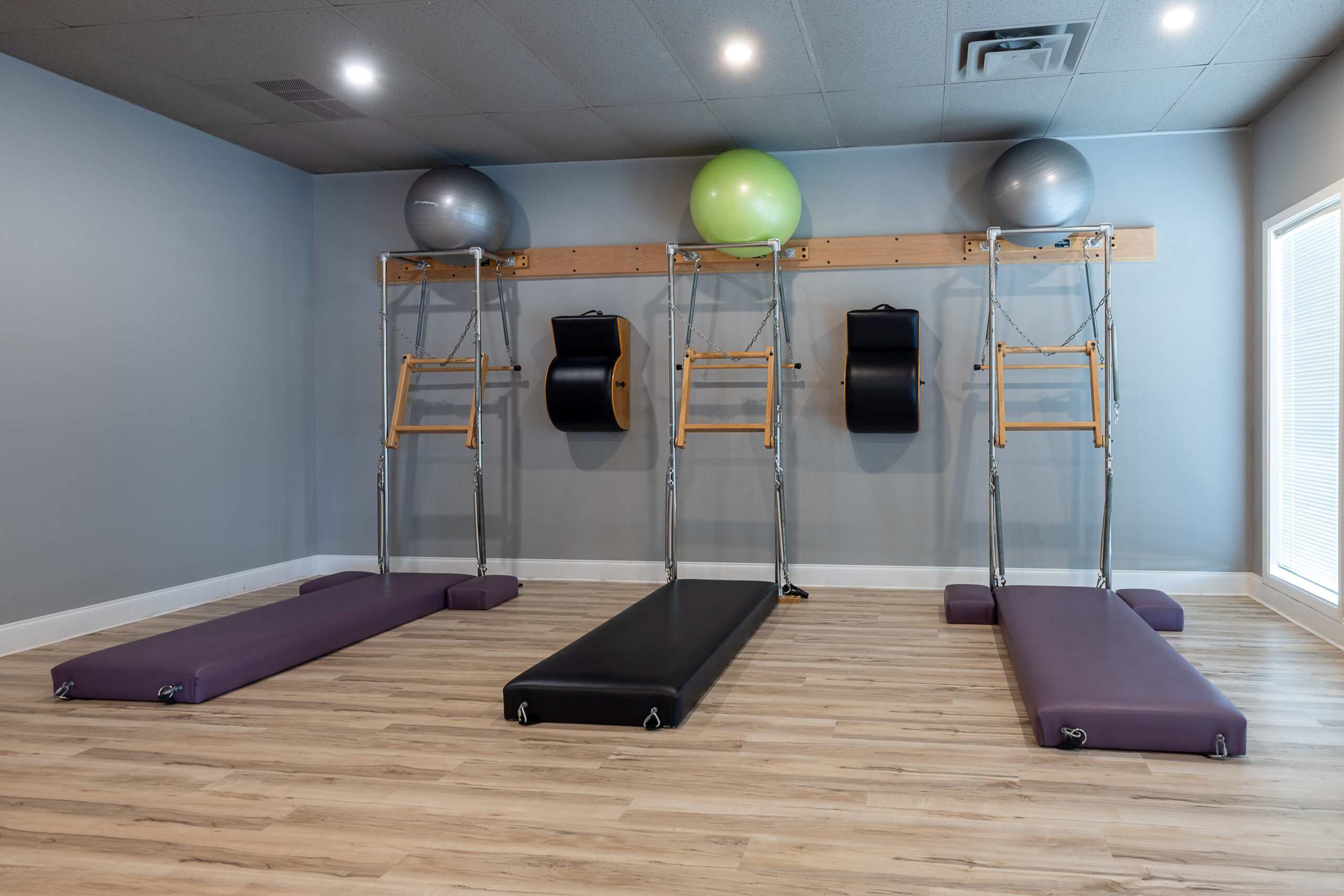 lady being instructed to perform a pilates activity