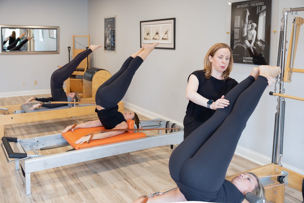 Instructor teaching trio lesson at Whole Body Massage and Pilates in Knoxville